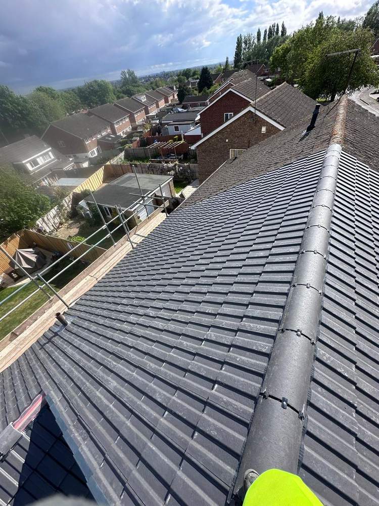 New grey tile roof after installation